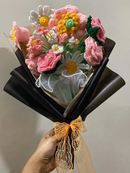 Wrapped in love, this forever pink crochet flower bouquet is sure to brighten anyone's day. The mix of different flower types and shades of pink makes it so special.