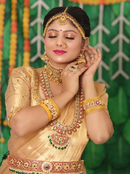 A close-up of the bride, showing the beautiful details of her makeup and jewellery.