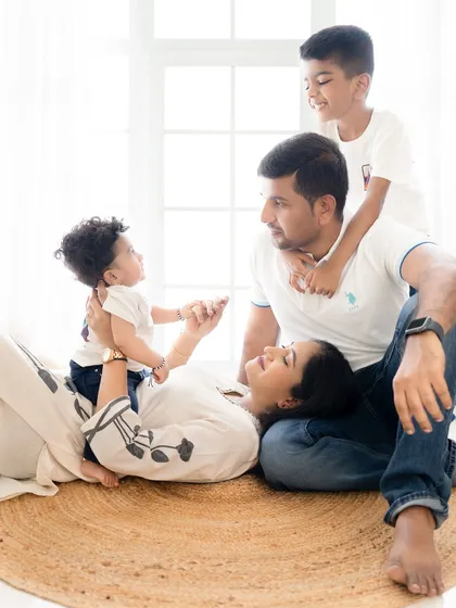 A candid moment from a beautiful family photoshoot in Bangalore. It's these unposed, playful interactions that truly capture the love and connection you share.
