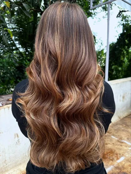 Her crowning glory. This stunning 'Butter Blonde' is warm, bright, and full of dimension. I used a balayage technique to create a natural, sun-kissed effect.