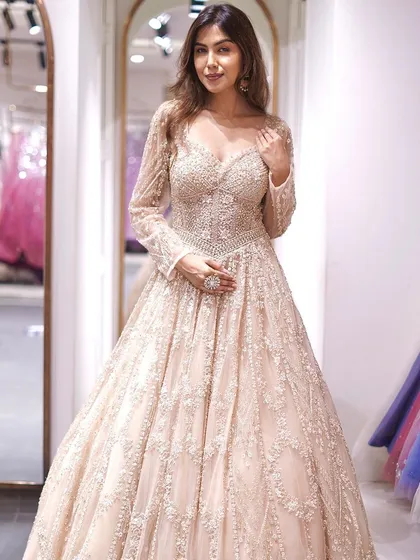 For your fairytale moment, this embellished gown is everything. Covered in delicate beadwork, it has a princess silhouette that’s perfect for an engagement or reception. I designed it to make you feel absolutely unforgettable.