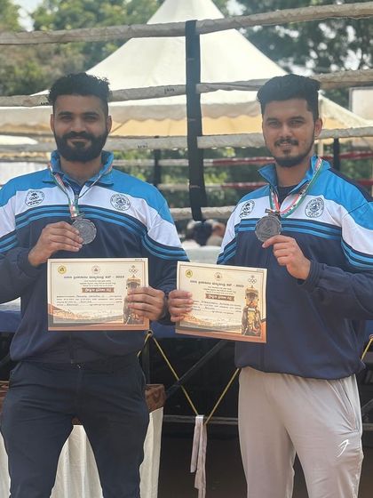 Double trouble. Two of our athletes proudly displaying their bronze medals and certificates.