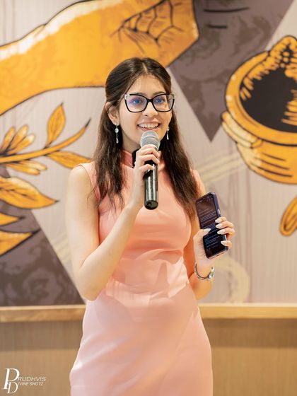 A young performer shares her poem with a smile. The theme was interpreted in many unique and personal ways.