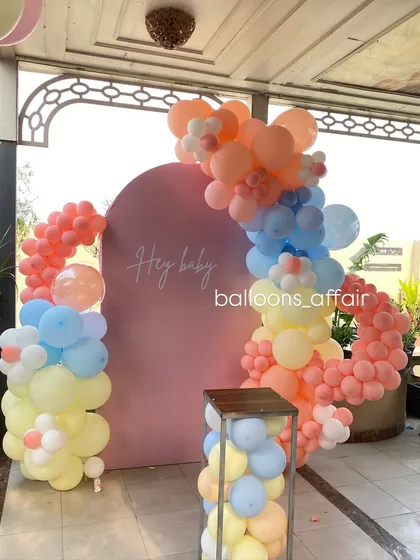 An angled view of the 'Hey Baby' pastel decoration, perfect for a cheerful and modern baby shower.