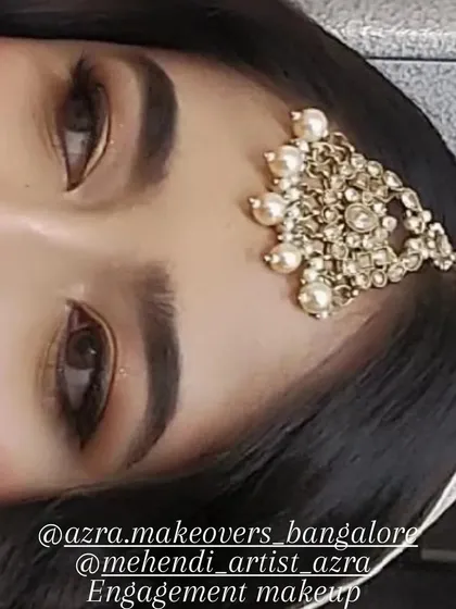 A close-up of a classic engagement makeup look. I focused on creating a soft, smokey eye with well-defined brows that enhance the client's natural features without feeling too heavy. This is a great example of my subtle glam style.