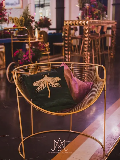 Custom-designed cushions are one of my favorite ways to tie a decor theme together. This velvet cushion with an embroidered dragonfly perfectly matches the napkin holders.
