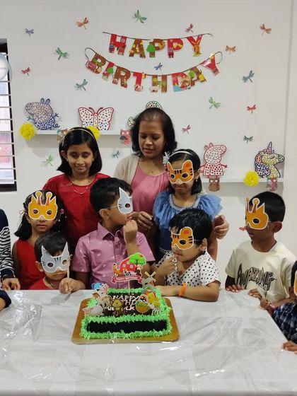 Roaring good times at this animal-themed birthday bash! The kids loved their art activity and are now ready for the cake cutting.