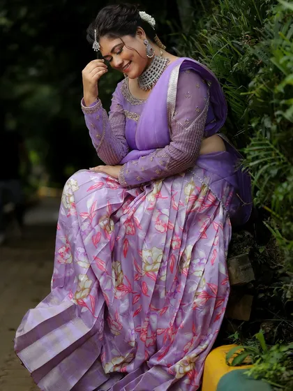 A model looking serene in a lavender saree, complemented by our elegant silver-finish American diamond choker and maang tikka.