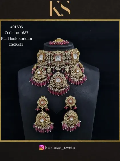 The real-look Kundan choker set in a classic all-ruby design. This is a bold and beautiful choice for a traditional wedding look.