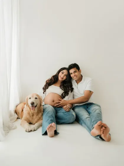 Yes, you can absolutely bring your fur baby. Pets are part of the family, and including them in your maternity photoshoot adds so much joy and personality. This sweet golden retriever was the perfect addition to this couple's casual session.