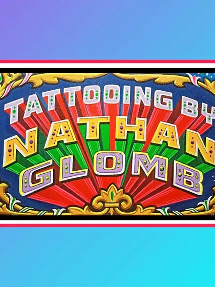 A separate sign just for the name "Tattooing by Nathan Glomb," featuring bold, colorful 3D lettering.