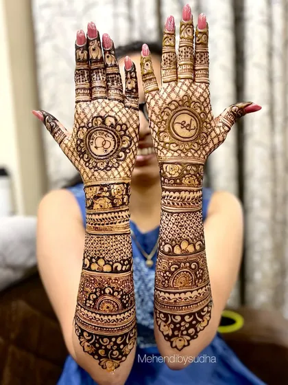 Siddhi happily showing her full engagement mehendi, complete with personalized initials.