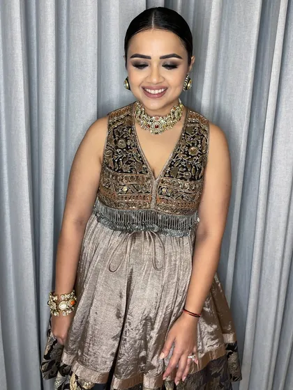 Another look at her defined eyes and radiant skin. This makeup is perfect for an evening party, providing glamour that feels comfortable.