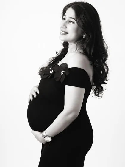 Black and white photography adds a timeless, emotional quality to maternity portraits. It strips away distractions and focuses on the pure form and feeling of the moment.