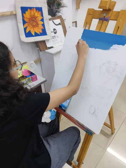 A series of images showing the progression of an acrylic seascape painting, from the initial blocking of colors to the addition of fine details.