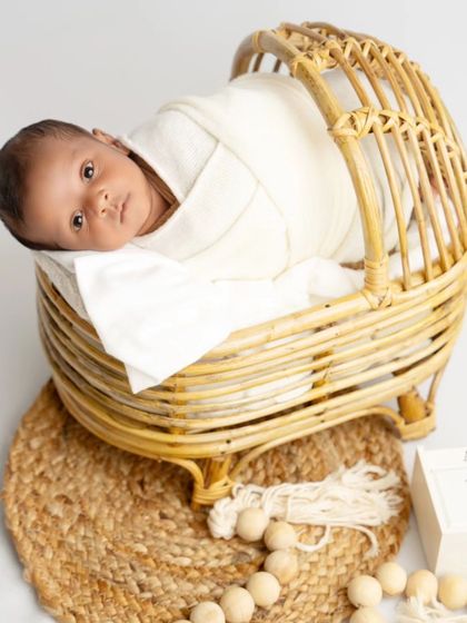 This alert newborn is taking in his surroundings from his cozy basket. I work at the baby's pace, whether they are sleepy or awake.