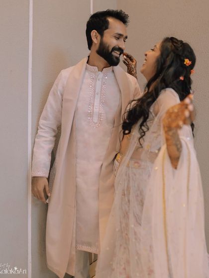 A candid moment of laughter and conversation. We believe in capturing the real, unposed moments that define your relationship.