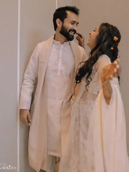 A candid moment of laughter and conversation. We believe in capturing the real, unposed moments that define your relationship.