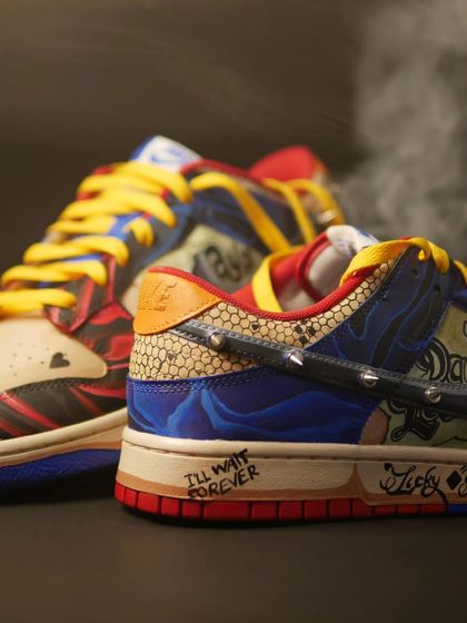 A close-up of the heel of the Harley Quinn custom, showing the "I'll wait forever" and "Lucky You" tattoo details.