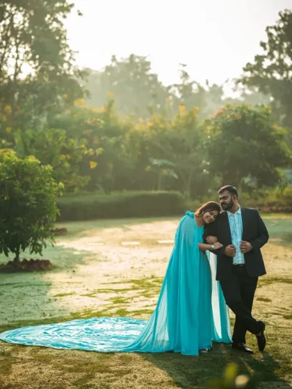 A romantic portrait in a misty, sunlit park. The light blue of the gown adds to the dreamy and peaceful atmosphere of the morning.