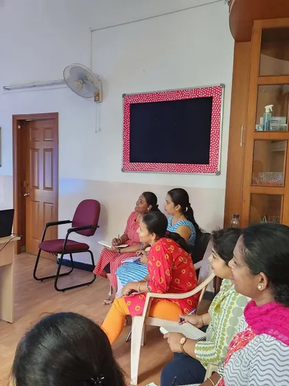 Our teachers listening to the presentation, focused on learning new techniques to support their students' behavioral and communicative development.