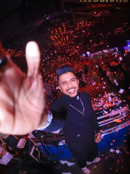 A selfie from the DJ booth during a confetti storm. This personal angle makes the viewer feel like they are right there with me.