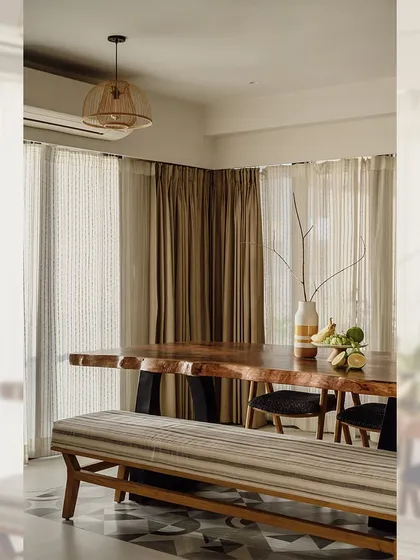 This dining setup combines different seating options. I built the live-edge table, the wooden dining chairs, and the upholstered bench, offering flexibility and a relaxed feel for this family dining area.