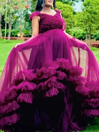 With over 200 designs, I can help you find the perfect outfit for your baby shower or maternity shoot, like this gorgeous magenta ruffle gown.
