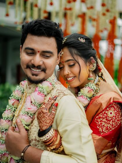 A romantic couple shot, the bride's glowing makeup is the perfect complement to her happy expression.