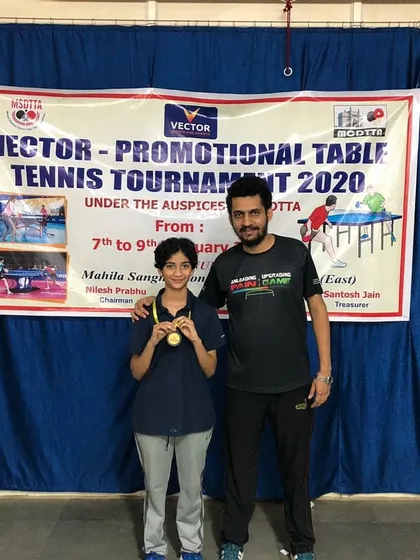 A proud coaching moment with Ansh Karnavar, the winner of the U-12 category at the Vector Promotional Table Tennis Tournament.