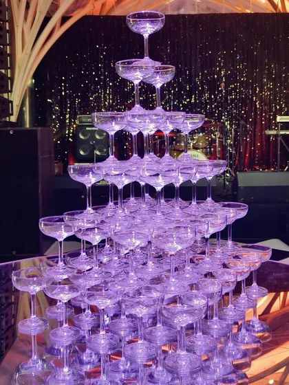 For moments that call for pure grandeur, we can create a magnificent champagne tower. This classic centerpiece adds a spectacular touch of elegance and excitement, perfect for kicking off a wedding reception or milestone celebration in style.