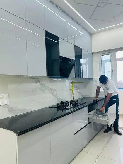 Demonstrating the cutlery drawer in this newly installed modular kitchen. Smart storage solutions are essential for an organized kitchen.