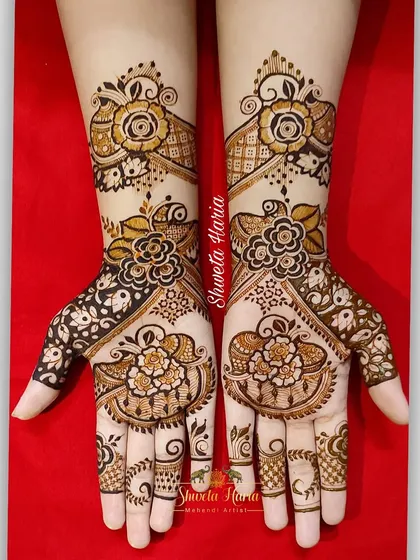 A beautiful full-hand floral design. This pattern uses a mix of bold, filled-in flowers and delicate line work to create a rich and varied texture.