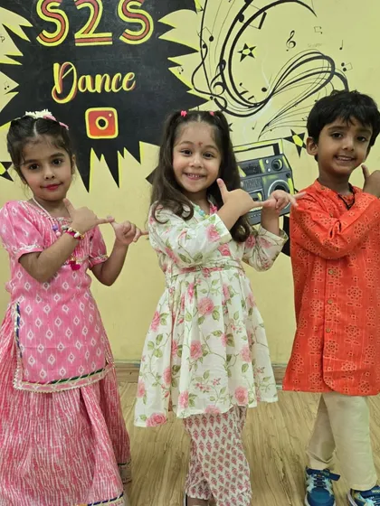 Three little dancers posing in their lovely ethnic outfits during our Janmashtami festivities.