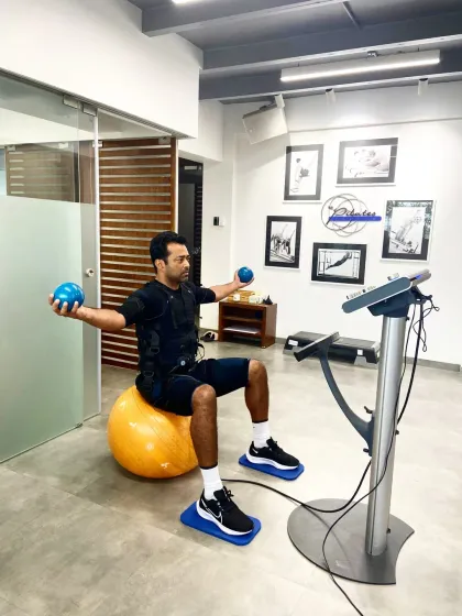 Leander Paes incorporates EMS with stability exercises, using a Swiss ball to challenge his core while the suit activates his muscles. This is advanced training for a world class athlete.