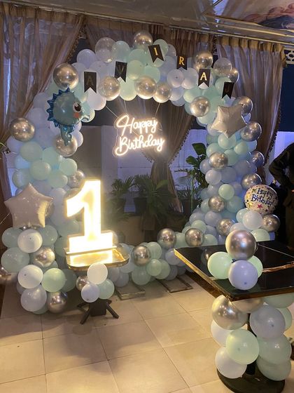 Another angle of the pastel blue and silver first birthday setup.