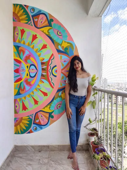A balcony with a view and a splash of color. This vibrant, hand-painted mandala was designed to be a focal point for meditation and relaxation in an outdoor setting.