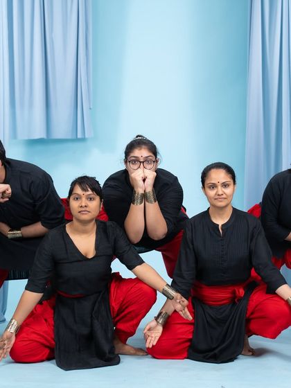 Our adult Kalaripayattu students in their performance attire, showcasing the strength and intensity of their practice during a studio shoot.