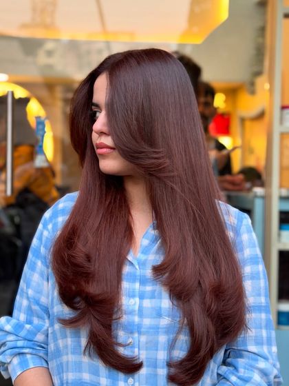 This global hair color blends copper and brown hues for a look that makes a big statement with subtle, sophisticated touches.