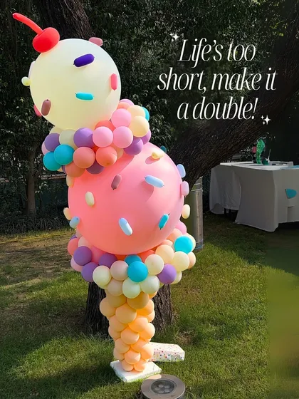 Life's too short, make it a double! This two-scoop balloon ice cream cone sculpture, complete with a cherry on top, is a whimsical and fun addition to any birthday party.