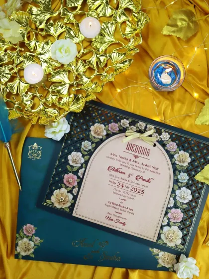 A full flatlay of the floral laser-cut invitation suite, showcasing the card, envelope, and decorative elements that create a luxurious experience.