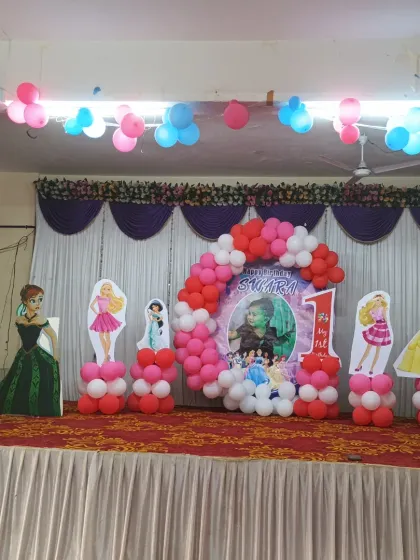 A wide view of the Princess theme stage decoration in a party hall.