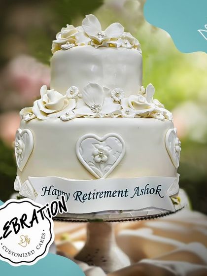 A grand, all-white two-tier cake for a grand occasion. I was honored to create this beautiful retirement cake for Ashok from Nirvana, wishing him a future as sweet as this creation.