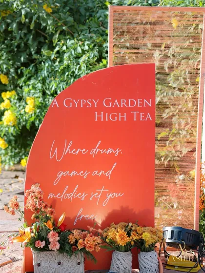 The welcome sign for the 'A Gypsy Garden High Tea', setting a whimsical and free-spirited tone for the event.