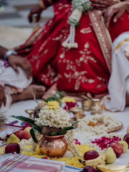 A close-up of a traditional wedding ritual, with a sacred kalash at the center. I ensure every cultural detail is respected and beautifully presented.