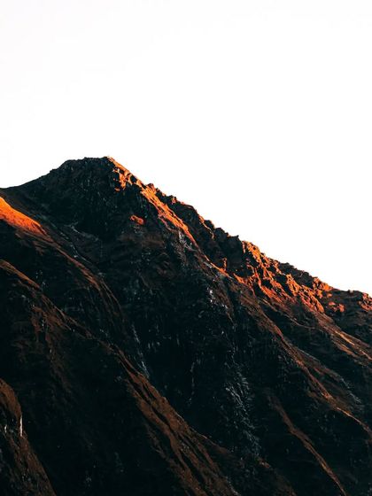 The first light of dawn hitting the peak of a mountain near Kedarnath. Chasing sunrises at high altitudes is challenging but rewards with moments of pure, unfiltered beauty like this.
