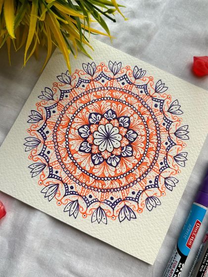 Another view of the simple yet striking orange and purple mandala. The patterns are clean and the colors are vibrant.