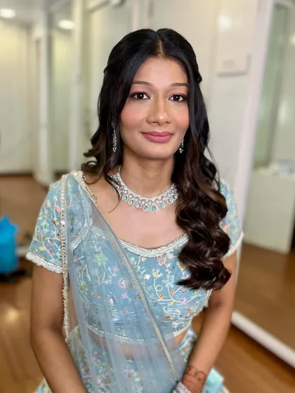 A soft and romantic engagement look. I used pink tones on the eyes and lips to complement her beautiful pastel blue lehenga.