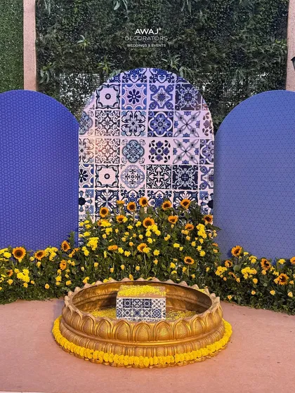 A clean, symmetrical view of the Haldi ritual backdrop, showcasing the beautiful blend of modern prints and traditional elements.