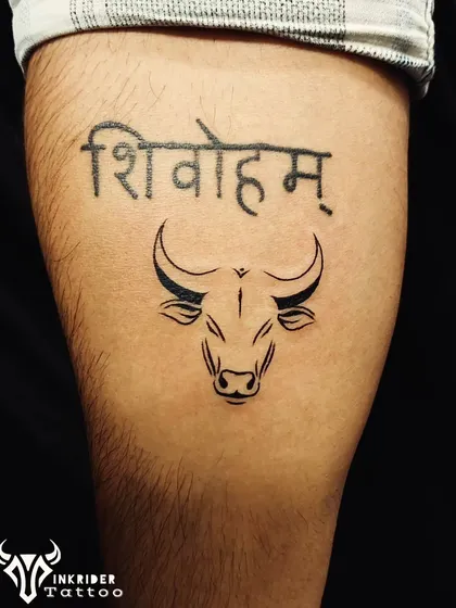 A bold declaration of faith, this tattoo combines the sacred phrase 'Shivoham' with the powerful symbol of a bull. The clean lines and strong font make it a standout piece.